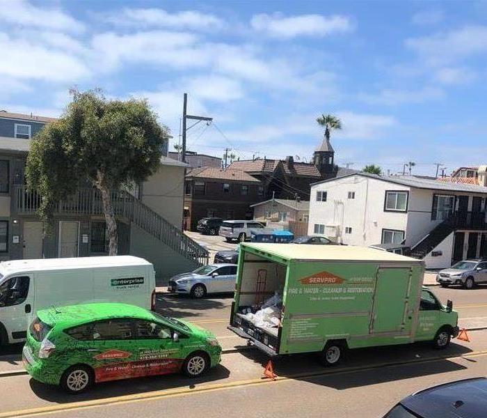 SERVPRO vehicles getting a tan in the San Diego sun