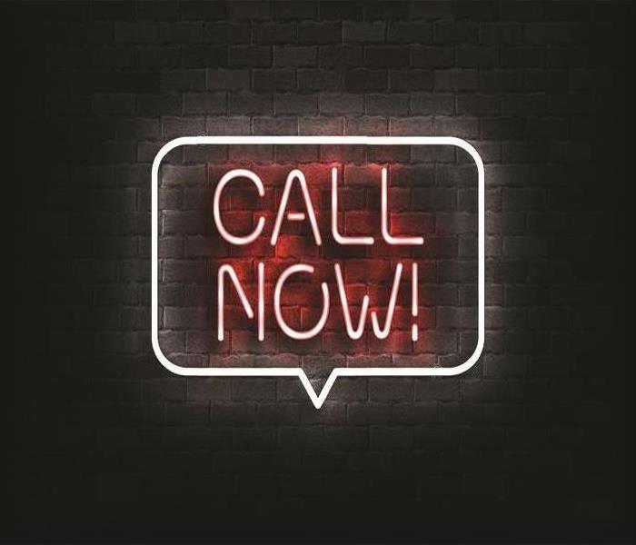 Neon sign that says "Call Now."