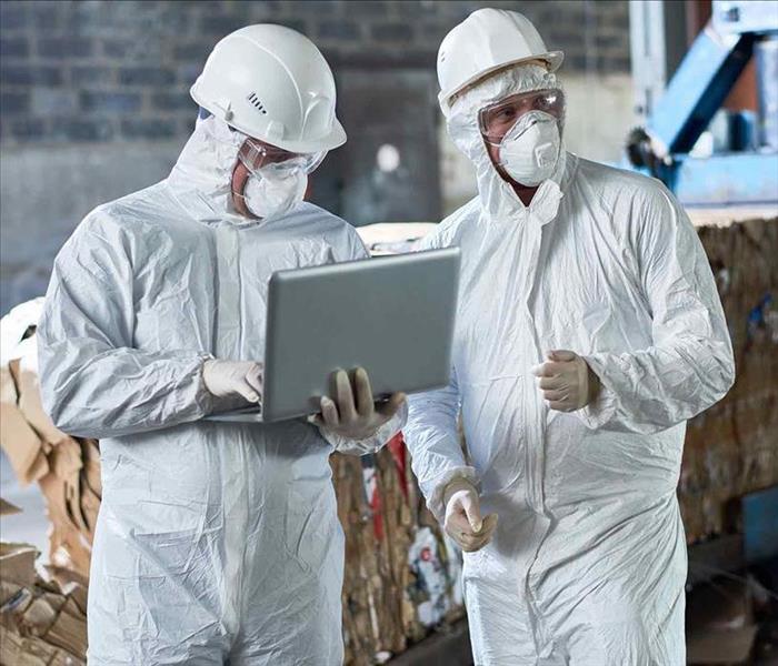 two technicians with biohazard suit