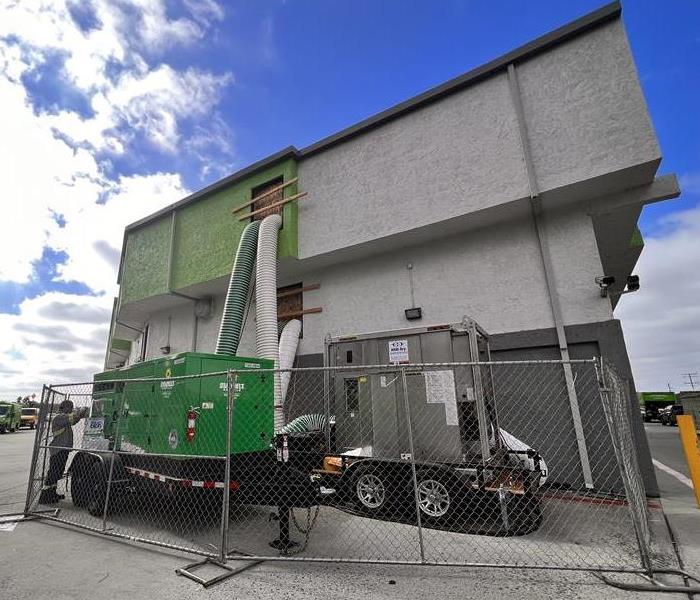 Large loss equipment outside a commercial job site.