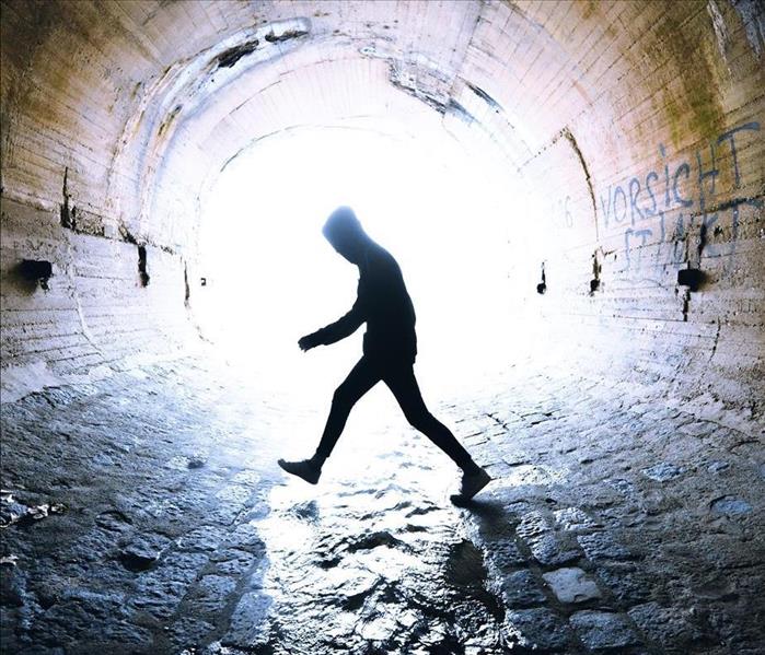 person walking in sewer