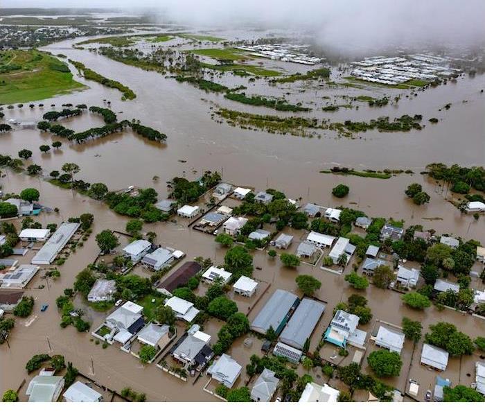 Submerged homes and roads indicate extreme flooding damage.