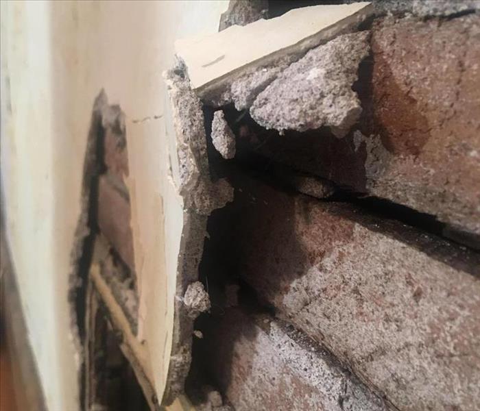 a close up image of Asbestos in a customers drywall.