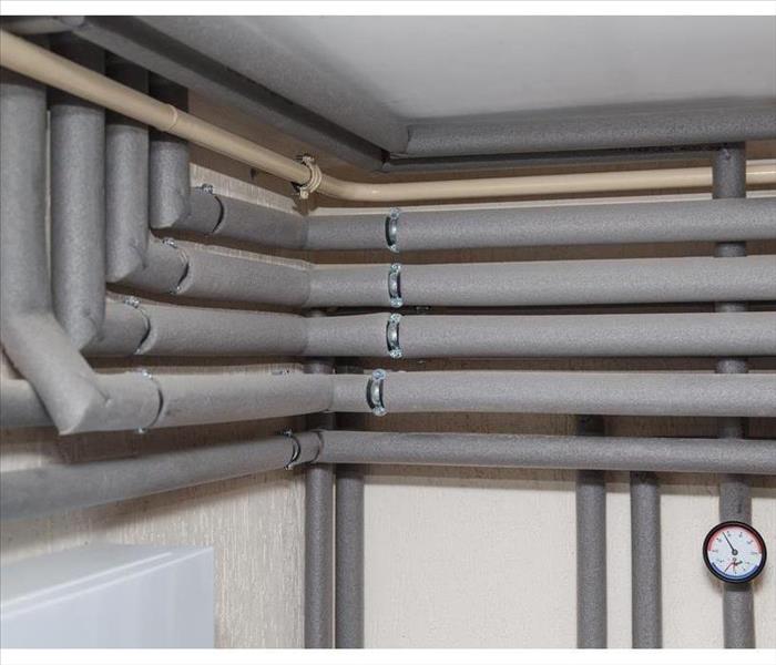 Plumbing system covered with insulation covers.